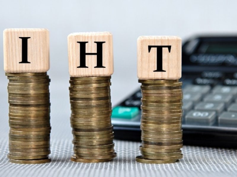 Photo of piles of coins with wooden blocks on top spelling out IHT signifying Inheritance Tax Planning